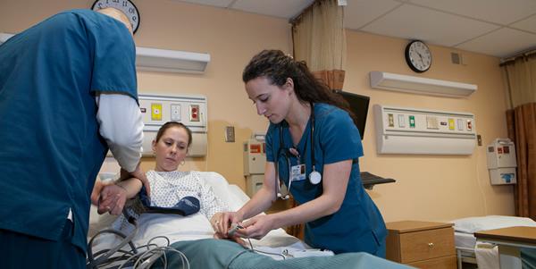 Graphic of Nursing Students working in Lab
